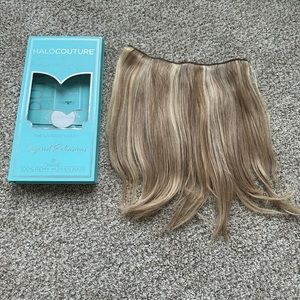 Hall Couture extensions 14” layered.  Letting natural hair color grow out.